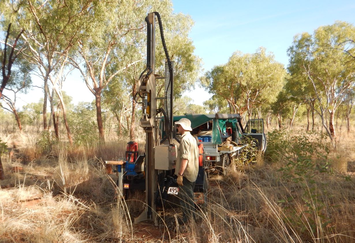 Soil scientists coring soil in the Dunmarra area