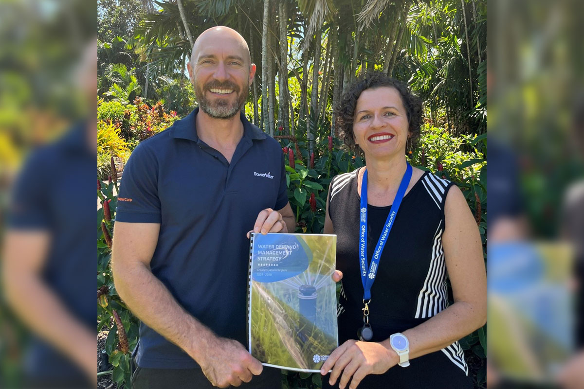 Joel Spry (Manager, Demand Management, Power and Water Corporation) and Nerida Horner (Executive Director, Office of Water Security, Department of Environment Parks and Water Security) with a copy of the Strategy.